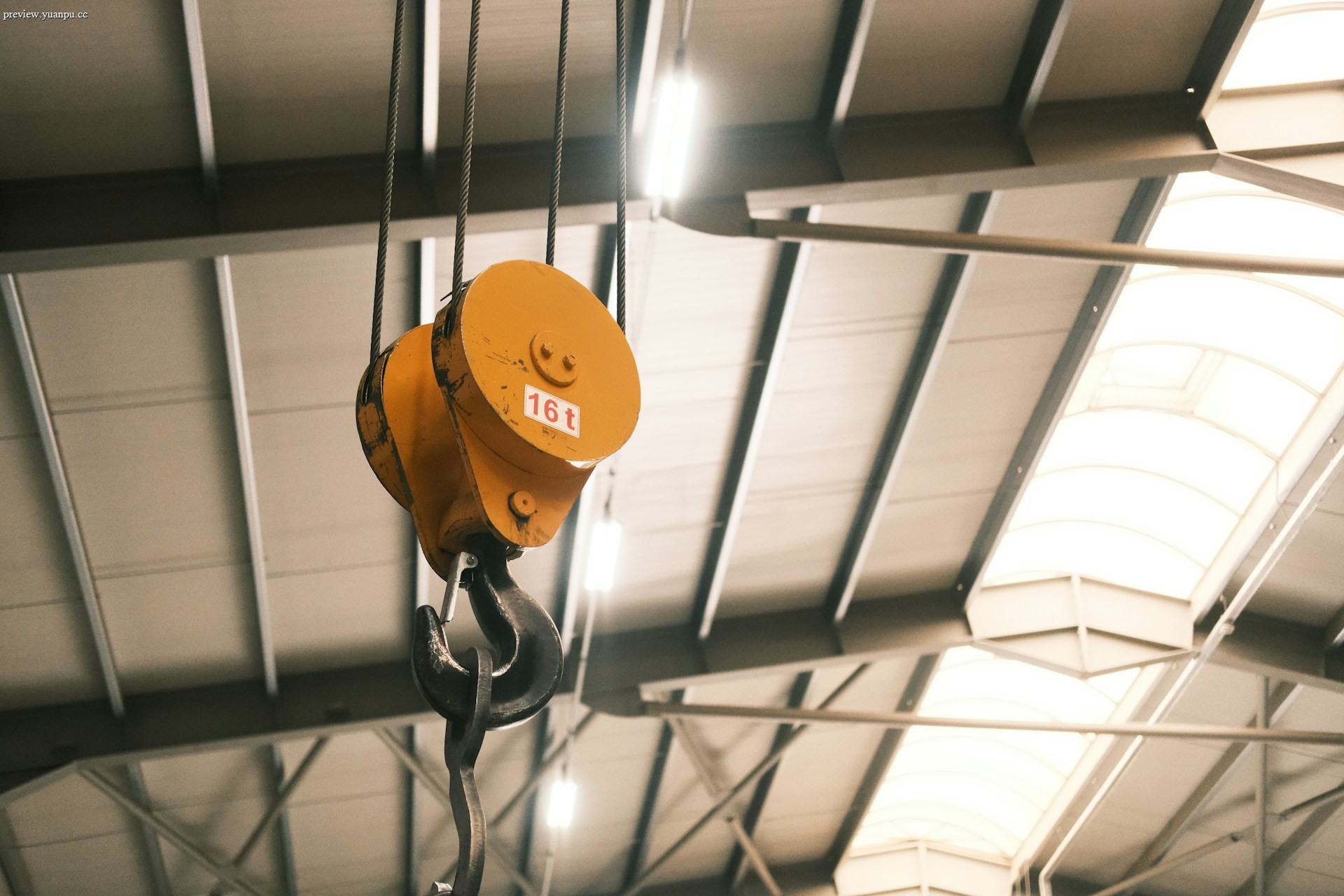 Industrial overhead crane lifting a heavy load