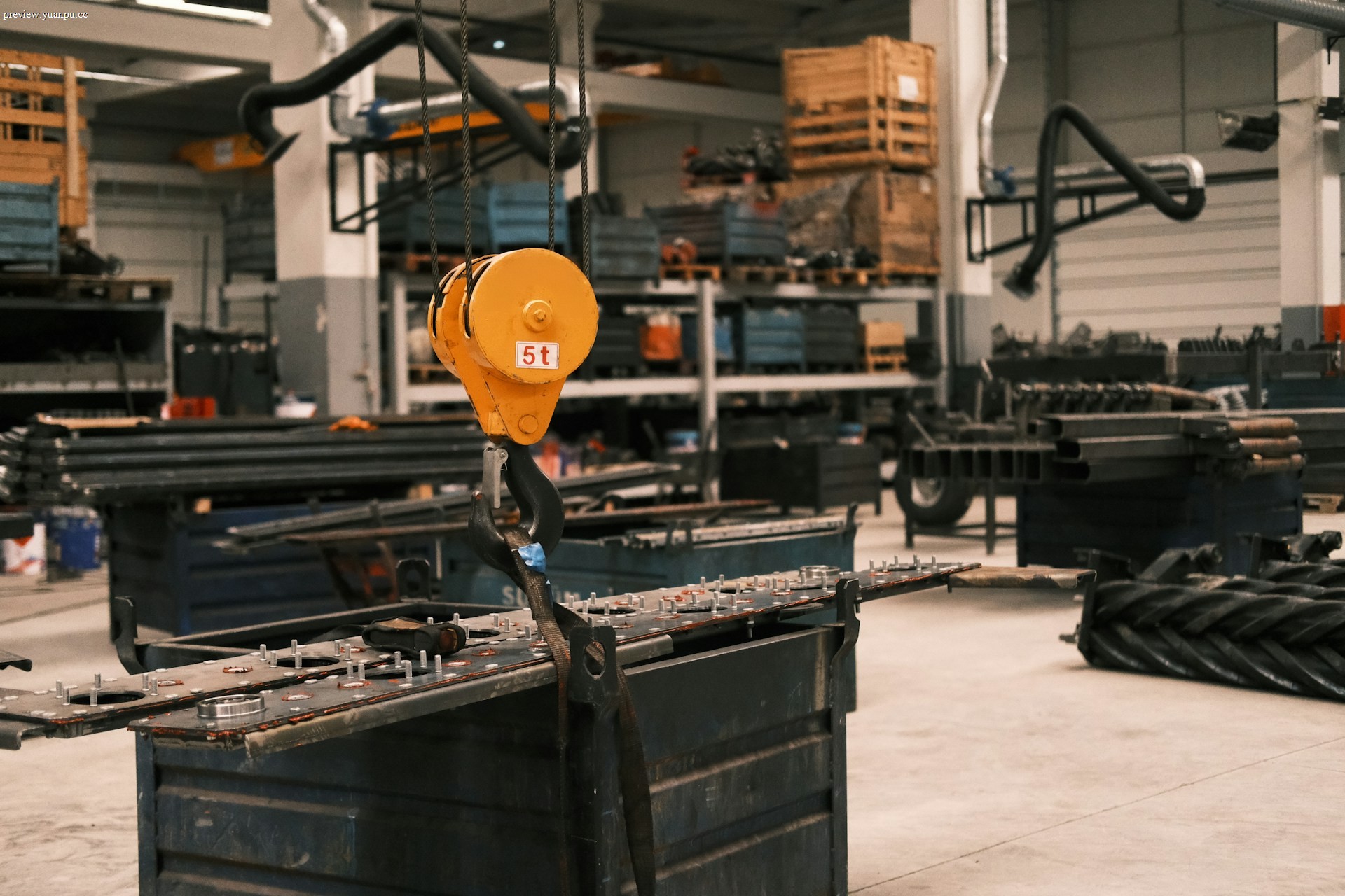 Industrial overhead crane lifting a heavy load