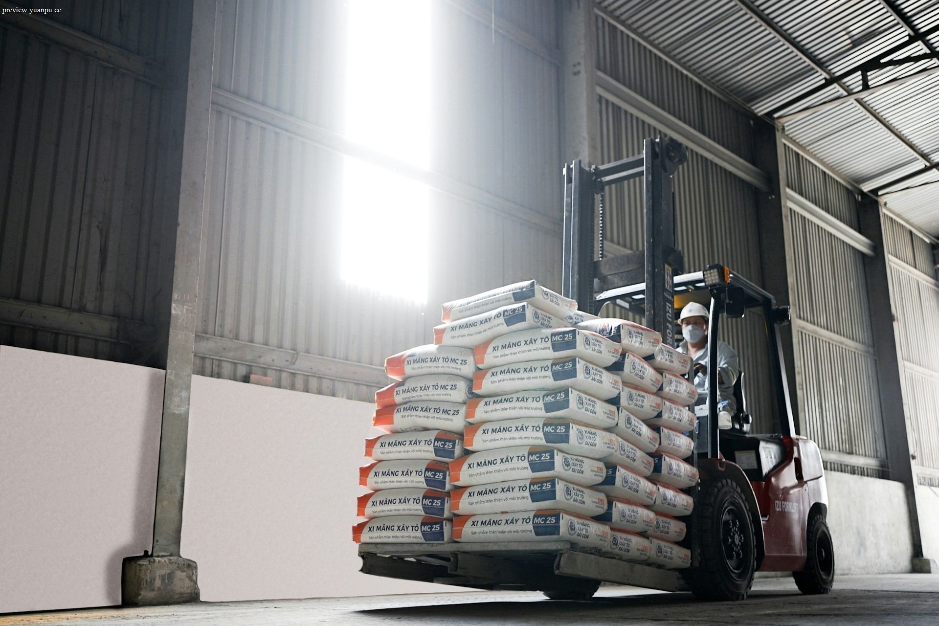 Forklift moving pallets in a warehouse