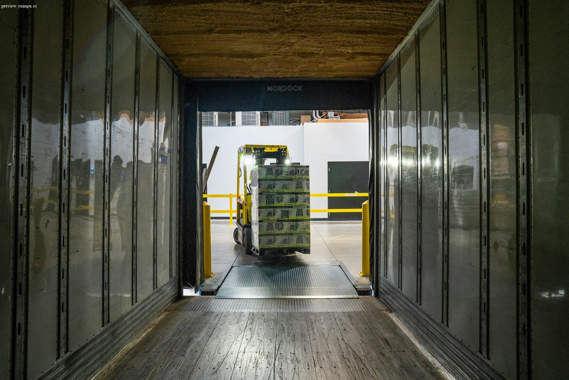 Forklift moving pallets in a warehouse